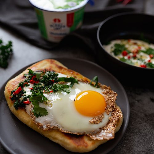 Pitta bread, toasted sesame seed egg, spicy bibeleskaes sauce and fresh herbs